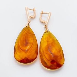 New gold earrings with artificial amber